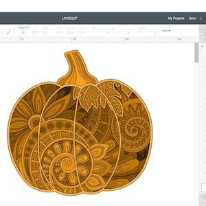 May include: A detailed pumpkin design with intricate patterns, displayed on a white background within the Cricut Design Space software. The pumpkin is a warm orange color with darker brown accents, featuring floral and spiral motifs. The software interface is visible.