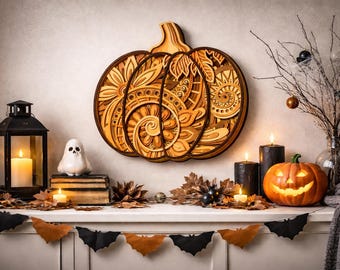 May include: A wooden pumpkin wall hanging with intricate designs is the focal point of a Halloween display. A carved jack-o'-lantern, candles, and a ghost figurine are also present. A garland of bats and leaves decorates the mantel.