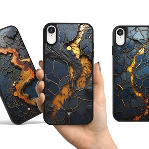 May include: Three black phone cases with a cracked gold and blue design. The cases have a raised camera bump.