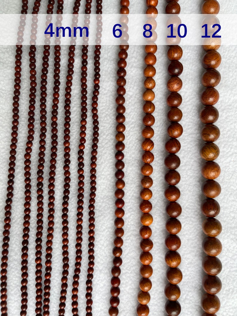 May include: Multiple strands of round, dark brown wooden beads arranged in vertical rows. The image displays labels indicating bead diameters of 4mm, 6mm, 8mm, 10mm, and 12mm, showing the varying sizes of the beads from smallest to largest.
