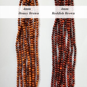 May include: Two vertical strands of 4mm round wooden beads. The left strand is honey brown, and the right strand is reddish brown. Text labels above the beads read 4mm Honey Brown and 4mm Reddish Brown, indicating the size and color of each.