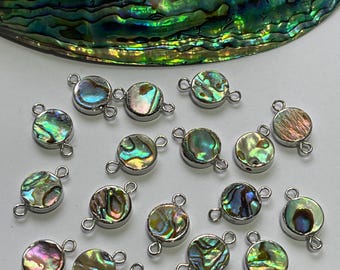 May include: A collection of 18 iridescent abalone shell round connector charms with silver-toned jump rings. The charms are perfect for jewellery making and crafting.