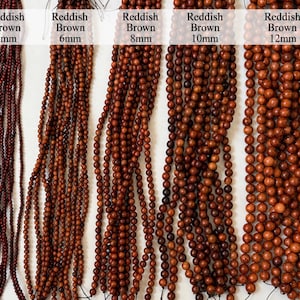 May include: Five strands of reddish brown beads arranged vertically, labeled by size as 4mm, 6mm, 8mm, 10mm, and 12mm. Each strand consists of numerous spherical beads strung together, showing a consistent color gradient across all five variations.