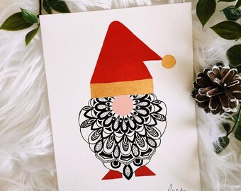 May include: A whimsical Christmas card featuring a gnome design. The gnome has a red hat, a gold band, and a black and white patterned beard. The card is signed "Ahea" in the bottom right corner. The card is on a white background.