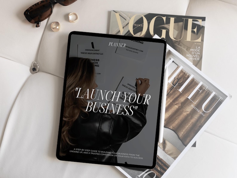 K&ouml;nnte beinhalten: Ein Tablet-Bildschirm zeigt einen Business-Planer mit dem Text "Starten Sie Ihr Unternehmen" und eine Schritt-f&uuml;r-Schritt-Anleitung zum Aufbau eines Unternehmens von Grund auf.