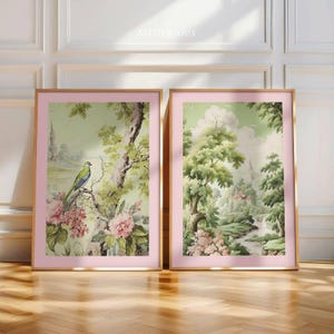 A pink green art set of two digital downloads. The first print shows a vivid green bird with a blue head perched on a branch among pink peonies, with a tower visible through the foliage. The second is a lush chinoiserie landscape with tall trees, a winding river and a distant cottage. Both files are print-ready in all major ratios. Instant download, no physical item shipped.