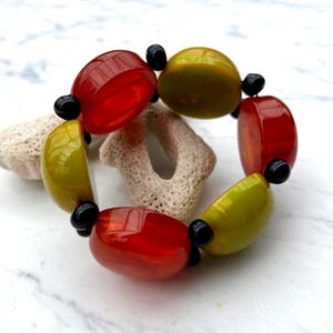 old resin bracelet (Galalithe) on piece of white coral (without corao!)