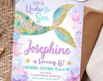 May include: A printable mermaid-themed birthday invitation with a purple, blue, and green colour scheme. The invitation features a mermaid tail with gold glitter, a seahorse, a starfish, and a crab. The text on the invitation reads "Join us Under the Sea Josephine is turning 6! Saturday, October 10 at 4 PM Our House 11 Flotsam Street, Ocean City RSVP to Mom 123-456-7890"