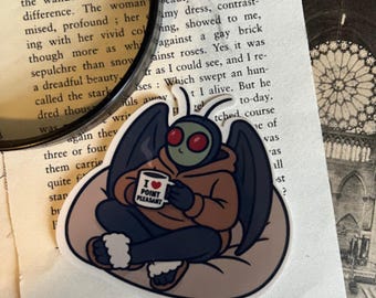 Mothman Self Care Sticker Glossy Vinyl Cute Cryptid Drinking Coffee on Beanbag Chair Cozy Spooky Sticker Gift for Mothman Fans