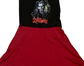 May include: A black and red sleeveless dress with a graphic print of Rob Zombie's face and the text "Rob Zombie".