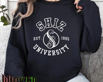 Wit Wicked Shiz University, uniseks Heavy Blend™-sweater met ronde hals | Sweatshirt muziektheater | Broadway-merchandise | Wicked-sweater