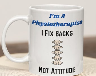 May include: White ceramic mug with the text "I'm A Physiotherapist I Fix Backs NOT ATTITUDE" in blue and black. A spine graphic is featured below "I Fix Backs". The mug has a curved handle and is sitting on a book.
