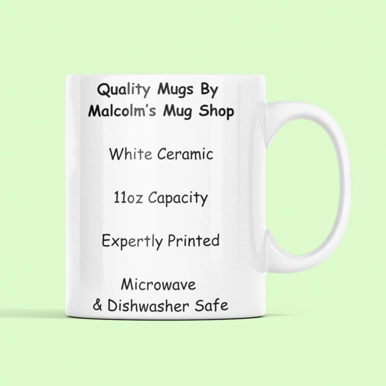 May include: White ceramic mug with black text that reads "Quality Mugs By Malcolm's Mug Shop", "White Ceramic", "11oz Capacity", "Expertly Printed", "Microwave & Dishwasher Safe".