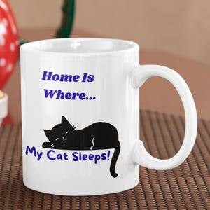 Funny Cat Mug “Home Is Where My Cat Sleeps” Printed On A 11oz Ceramic Mug, Cat Lover Cup | Cute Cat Gift Mug For Animal Lover, Cat Mum Mug.