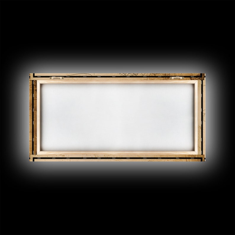 an empty picture frame on a black background