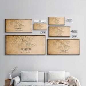 a living room with a couch and a map on the wall