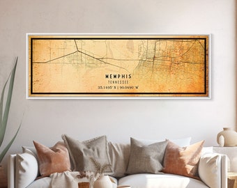 May include: A vintage-style map print of Memphis, Tennessee. The map is printed on a beige background with brown and black lines representing roads and waterways. The city name and coordinates are printed in black at the bottom of the map.