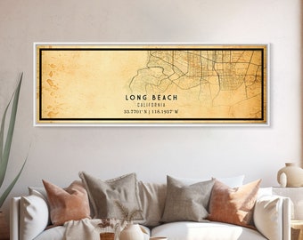 May include: A vintage-style map print of Long Beach, California, with a faded yellow background and black lines depicting streets and waterways. The text "LONG BEACH CALIFORNIA 33.7701' N | 118.1937' W" is printed in black at the bottom of the map.