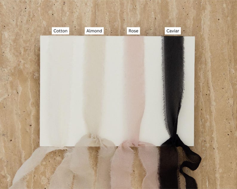 May include: Four samples of ribbon in different colors: Cotton (white), Almond (cream), Rose (pale pink), and Caviar (black).