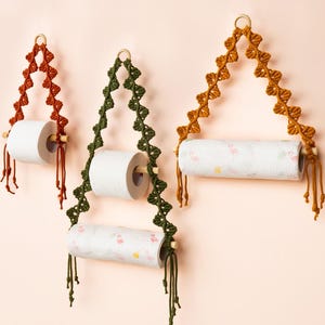 May include: A white ceramic mug with a black handle and the text "But First, Coffee" in a black, bold font. The mug is on a white surface.