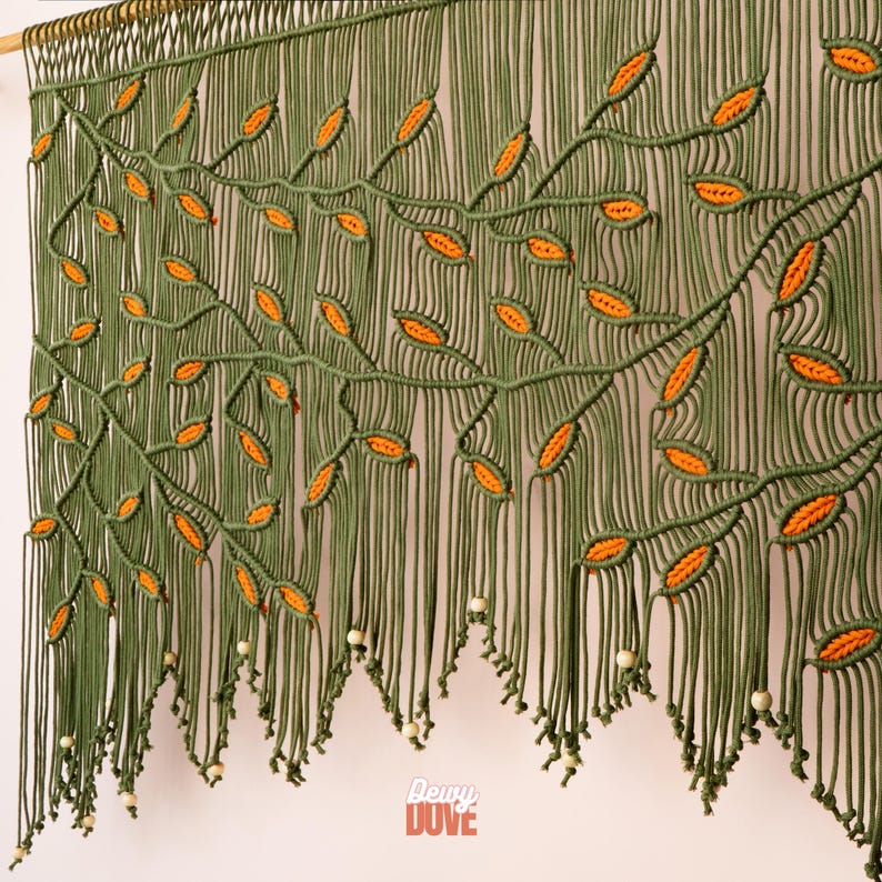 Sophisticated macrame doorway curtain in a rich botanical olive and orange colorway.