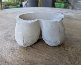 Pot with boobies made from concrete