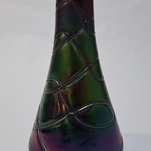 A large Art Nouveau iridescent bohemian art glass vase attributed to Loetz