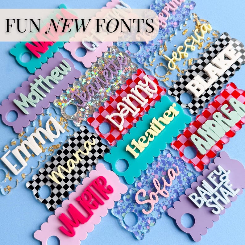 a collection of colorful name tags or tags with various names written on them, arranged in a visually appealing manner.