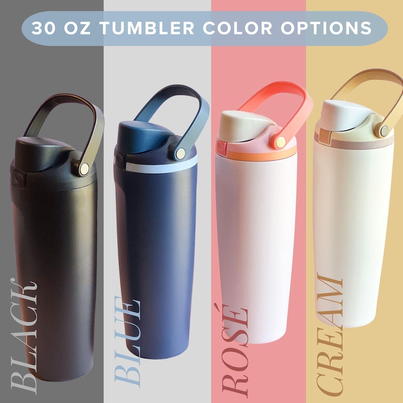four different colored tumblers, each with a handle, arranged in a row against a neutral background.