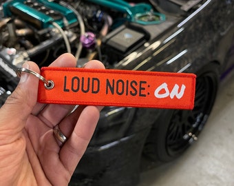 LOUD NOISE: ON Fast Car Key chain