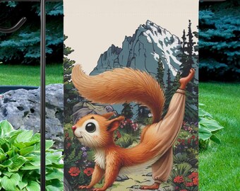 May include: A garden flag featuring a cartoon squirrel doing yoga in front of a mountain range. The squirrel is orange and brown with a white belly and large, round eyes. The mountain range is blue and white with snow on the peaks. The flag is printed on a cream-colored fabric.