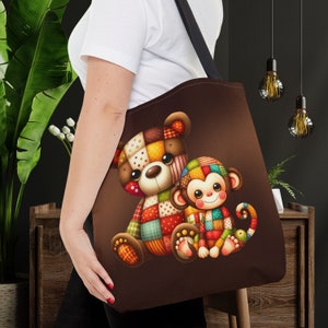 May include: A brown tote bag featuring a patchwork bear and monkey design. The bear and monkey are both smiling and have colourful patchwork fur.