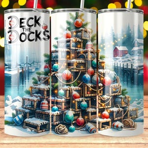 May include: A stainless steel tumbler with a festive design. The tumbler features a Christmas tree made of lobster traps, ornaments, and the text "Deck the Docks". The background shows a snowy harbor scene with boats and a red house.