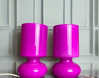 Pair colorful glass bedside table lamps pink fuchsia Ikea Lykta mood enhanging lighting