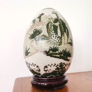 Decorative porcelain African animals safari egg on wooden base