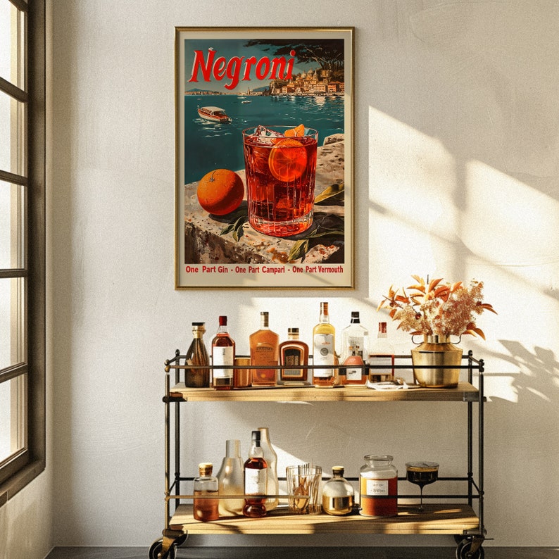 May include: A vintage poster advertising Negroni, an Italian cocktail. The poster features a glass of Negroni with an orange slice and ice cubes, set against a scenic backdrop of a harbour with boats. The text on the poster reads "Negroni" and "One Part Gin - One Part Campari - One Part Vermouth".