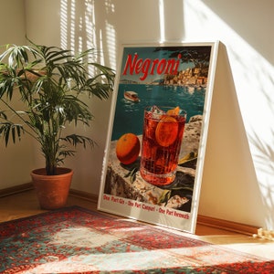 May include: A vintage poster advertising Negroni, a classic Italian cocktail. The poster features a glass of Negroni with ice and an orange slice, along with a scenic view of a harbour. The text on the poster reads "Negroni" and "One Part Gin - One Part Campari - One Part Vermouth."
