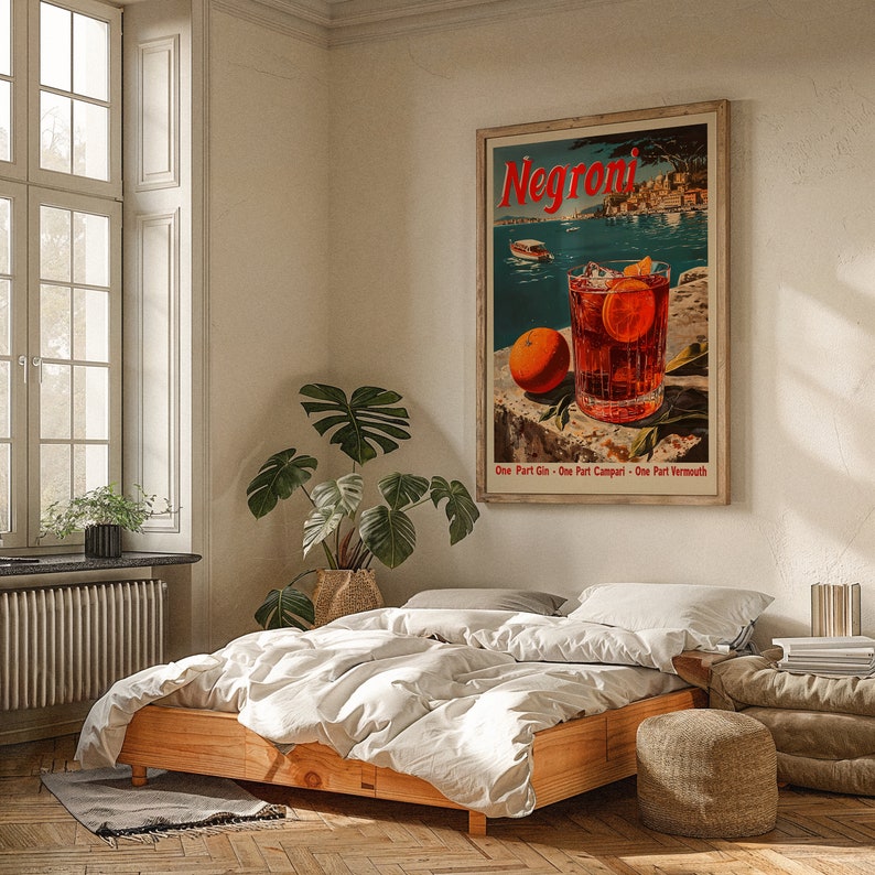May include: A vintage poster advertising Negroni, a classic Italian cocktail. The poster features a glass of Negroni with an orange slice, against a backdrop of a picturesque Italian harbour. The text on the poster reads "Negroni" and "One Part Gin - One Part Campari - One Part Vermouth".