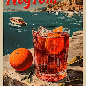 May include: A classic Negroni cocktail with a slice of orange, ice cubes, and a red liquid in a clear glass. The glass is sitting on a stone surface with green leaves. The background shows a cityscape with a body of water.