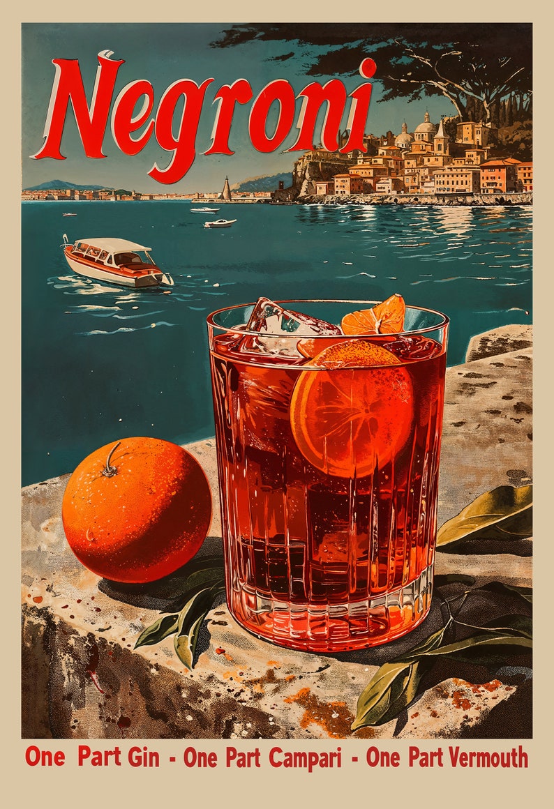 May include: A classic Negroni cocktail with a slice of orange, ice cubes, and a red liquid in a clear glass. The glass is sitting on a stone surface with green leaves. The background shows a cityscape with a body of water.