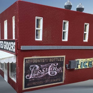May include: A red brick building with a white awning and a sign that says "United Grocers". There are three windows on the front of the building. There are two signs on the side of the building, one for Pepsi-Cola and one for ice.