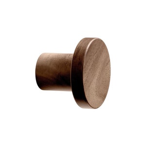 May include: A dark brown wooden wall hook with a round top. The hook is made of solid wood and has a simple, minimalist design.