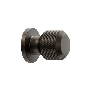 May include: A dark bronze door knob with a circular base and a textured, cylindrical handle. The handle has a diamond pattern. The knob is designed for easy installation. The door knob is a stylish addition to any door.