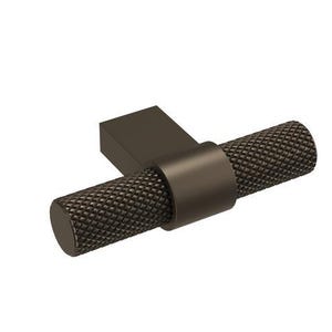 May include: A bronze cabinet pull with a textured, cylindrical handle. The handle is attached to a rectangular base. The hardware is designed for use on drawers and cabinets. The overall design is modern and minimalist.