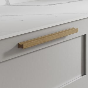 May include: A light grey kitchen cabinet with a white marble-effect countertop. The cabinet doors have light wood handles. The countertop is a clean, modern design.