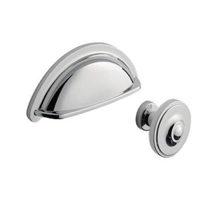 May include: A set of two polished chrome cabinet hardware pulls. One is a cup pull and the other is a knob.