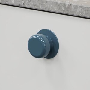 May include: A close-up of a blue cabinet knob with a round shape and a matching circular backplate. The knob is mounted on a white cabinet door, with a grey countertop visible in the background. The knob has a glossy finish.