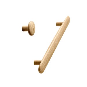 May include: Two wooden cabinet knobs, one is a long rectangular bar and the other is a round knob. Both are made of light wood.