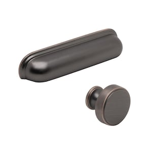 May include: Two pieces of cabinet hardware in a dark bronze finish. One is a long, curved pull, and the other is a round knob. Both pieces have a simple, classic design and are set against a white background.