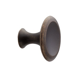 May include: A dark brown, round, decorative cabinet knob with a slightly raised edge and a textured finish.